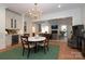 Elegant dining area with a chandelier and views into a cozy living space at 3119 Knowlton Ln, Charlotte, NC 28205
