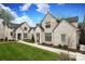 Beautiful white brick homes showcasing meticulous landscaping and inviting sidewalks under a sunny sky at 3119 Knowlton Ln, Charlotte, NC 28205