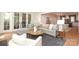 Open concept living room with lots of natural light, a gray sofa, and a round coffee table at 3119 Knowlton Ln, Charlotte, NC 28205