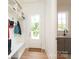 Mudroom has cubbies, a bench, and adjacent sink area at 3119 Knowlton Ln, Charlotte, NC 28205