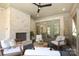 Cozy porch with a brick fireplace, white-washed brick wall and casual seating at 3119 Knowlton Ln, Charlotte, NC 28205
