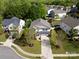 Aerial view of a home with a well-maintained lawn, mature trees, and a private driveway at 320 Allspice Rd, Fort Mill, SC 29708