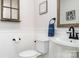 Stylish half bathroom featuring modern fixtures, a pedestal sink, and paneled walls at 320 Allspice Rd, Fort Mill, SC 29708