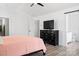 Bright bedroom with black dresser, wood floors and adjacent bathroom at 320 Allspice Rd, Fort Mill, SC 29708