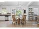 Bright dining area with natural light, a wooden table and views of the kitchen and back yard at 320 Allspice Rd, Fort Mill, SC 29708