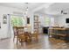 Bright dining area with natural light, a wooden table and views of the backyard at 320 Allspice Rd, Fort Mill, SC 29708