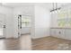 Bright dining room with hardwood floors and built-in cabinets providing a delightful eating space at 320 Allspice Rd, Fort Mill, SC 29708