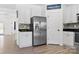 Bright kitchen featuring stainless steel appliances, white cabinetry and lots of storage space at 320 Allspice Rd, Fort Mill, SC 29708