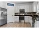 Well-equipped kitchen with stainless steel appliances, white cabinets, and a tile backsplash for a modern look at 320 Allspice Rd, Fort Mill, SC 29708