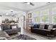 Open-concept living room connecting to the kitchen, filled with stylish furniture and natural light at 320 Allspice Rd, Fort Mill, SC 29708