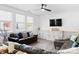 Inviting living room with large windows, comfortable seating, and a mounted TV for entertainment at 320 Allspice Rd, Fort Mill, SC 29708