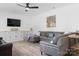 Comfortable living room featuring ample seating, modern decor, and a built-in TV at 320 Allspice Rd, Fort Mill, SC 29708