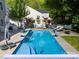 Backyard view of a swimming pool with lounge chairs, shade umbrella and privacy fence at 320 Allspice Rd, Fort Mill, SC 29708