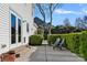Secluded backyard with a patio, green hedge, and comfortable chairs, perfect for outdoor enjoyment at 3217 Deep Meadow Ln, Charlotte, NC 28210