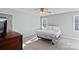 Light-filled bedroom with a ceiling fan, carpet flooring, and a view of the outdoors at 3217 Deep Meadow Ln, Charlotte, NC 28210