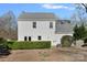 Back of home showing siding, green bushes and a grey roof at 3217 Deep Meadow Ln, Charlotte, NC 28210