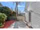 Side yard with a wooden fence and gate, offering a secure space with access to the house at 3217 Deep Meadow Ln, Charlotte, NC 28210