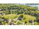 An aerial view of a neighborhood with lush greenery, several homes and golf course at 341 Canvasback Rd, Mooresville, NC 28117