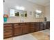 Elegant bathroom with a double vanity, granite countertops, and ample cabinet space at 341 Canvasback Rd, Mooresville, NC 28117