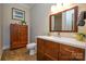 Bathroom features wood vanity and storage unit at 341 Canvasback Rd, Mooresville, NC 28117