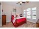 Cozy bedroom featuring a four-poster bed, natural light, and vaulted ceiling at 341 Canvasback Rd, Mooresville, NC 28117
