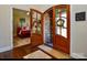 Inviting foyer featuring beautiful hardwood floors, arched door, and views of the bedroom at 341 Canvasback Rd, Mooresville, NC 28117