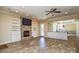 Open-concept living room with stone fireplace and built-in shelving at 341 Canvasback Rd, Mooresville, NC 28117
