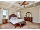 Comfortable main bedroom featuring a tray ceiling, a king-sized bed, and neutral decor at 341 Canvasback Rd, Mooresville, NC 28117