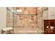 Luxurious tile shower with dual shower heads, built-in niches, and glass enclosure at 341 Canvasback Rd, Mooresville, NC 28117