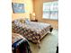 Bright bedroom with natural light and a cozy quilt at 3905 Farlow Rd, Charlotte, NC 28269