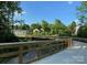 Picturesque view of a wooden bridge over a creek along a greenway trail at 3905 Farlow Rd, Charlotte, NC 28269