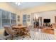 Cozy dining area features a breakfast table and an opening view of the living room and fireplace at 3905 Farlow Rd, Charlotte, NC 28269