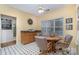 Bright dining area includes a table, cabinet and black and white tile floor at 3905 Farlow Rd, Charlotte, NC 28269