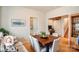Cozy dining room featuring hardwood floors and ample natural light, perfect for Gathering meals at 3905 Farlow Rd, Charlotte, NC 28269