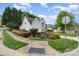 Charming two-story home with landscaped yard and mature trees at 3905 Farlow Rd, Charlotte, NC 28269