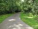 Scenic paved greenway trail surrounded by lush greenery, perfect for outdoor activities at 3905 Farlow Rd, Charlotte, NC 28269