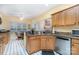 Well-lit kitchen with granite countertops and an adjacent eat-in area at 3905 Farlow Rd, Charlotte, NC 28269