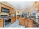 Bright kitchen featuring stainless steel appliances, a gas range, and granite countertops, offering both style and functionality at 3905 Farlow Rd, Charlotte, NC 28269