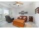 Inviting living room offers natural light, a ceiling fan, and comfortable seating at 3905 Farlow Rd, Charlotte, NC 28269