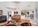 Bright, airy living room with hardwood floors and an open layout, seamlessly connecting to kitchen, den and sunroom at 3905 Farlow Rd, Charlotte, NC 28269