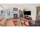 Comfortable living room with a fireplace and large TV, perfect for relaxation and entertainment with access to the outside at 3905 Farlow Rd, Charlotte, NC 28269