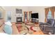 Cozy living room with fireplace, television, and large area rug at 3905 Farlow Rd, Charlotte, NC 28269