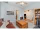 Comfortable living room features a ceiling fan, and a large decorative wall plate at 3905 Farlow Rd, Charlotte, NC 28269