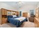 Relaxing main bedroom with vaulted ceiling, large windows, plush carpet, and comfortable seating with reading chair at 3905 Farlow Rd, Charlotte, NC 28269