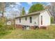 Backyard of a home featuring a brick foundation and an AC unit at 410 E Lee Ave, Bessemer City, NC 28016