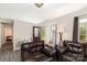 Cozy living room featuring modern furniture, laminate flooring, and a dark-colored accent door at 410 E Lee Ave, Bessemer City, NC 28016