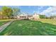 Beautiful backyard view featuring a spacious lawn perfect for entertaining at 421 Tranquil Bay Cir, Norwood, NC 28128