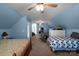 Spacious bedroom featuring two beds, neutral carpet, and a sitting area at 421 Tranquil Bay Cir, Norwood, NC 28128