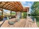 Well-maintained boat dock with lounging area and boat lift, perfect for enjoying waterfront activities at 421 Tranquil Bay Cir, Norwood, NC 28128