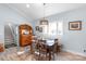 Traditional dining room featuring light blue walls, wood floors, and vintage wooden furniture at 421 Tranquil Bay Cir, Norwood, NC 28128